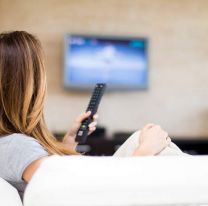 <p>Young woman watching TV in the room</p>

