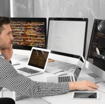 <p>Handsome young programmer working in office</p>