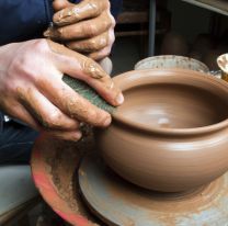 <p>hands of a potter, creating an earthen jar</p>